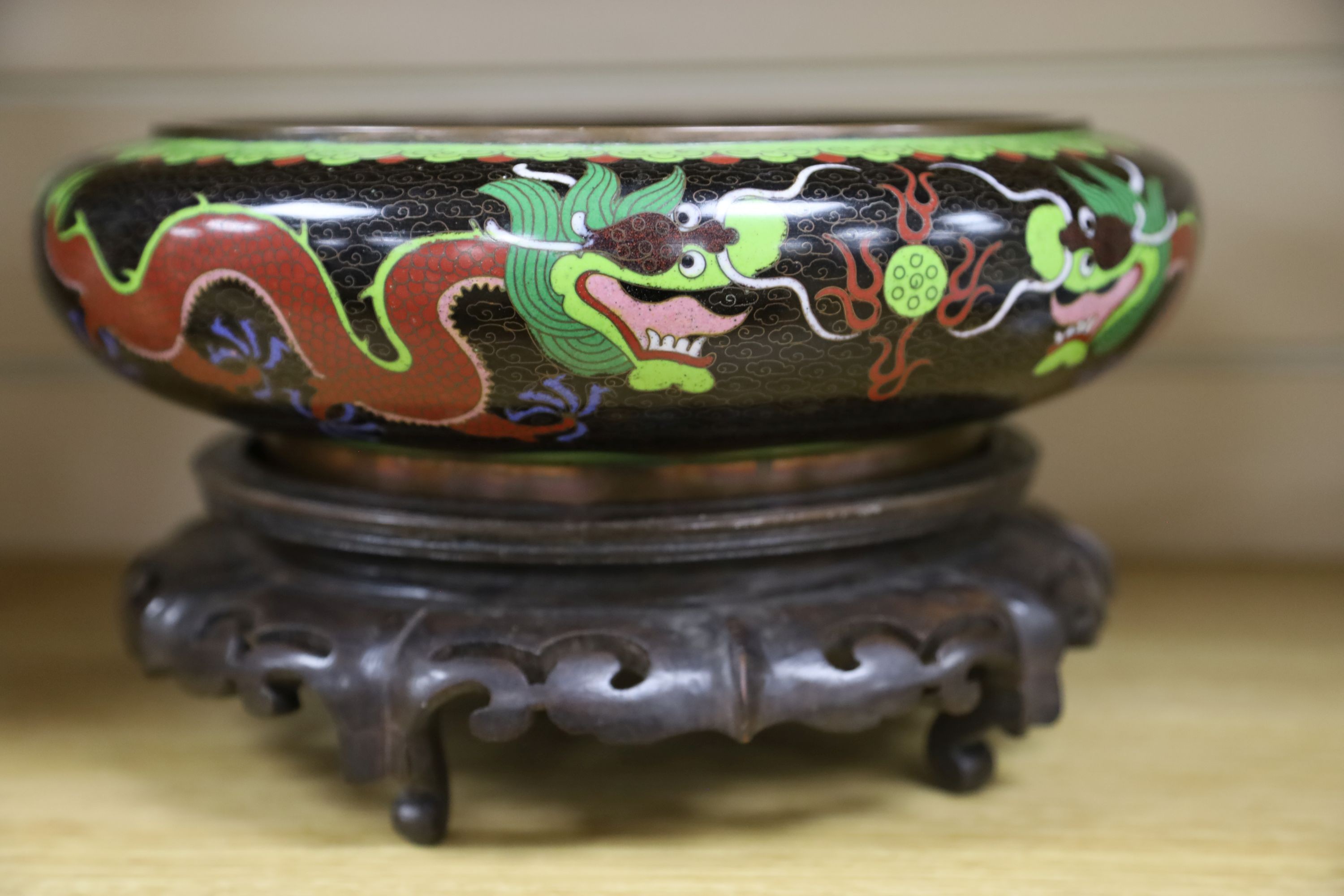 A large early 20th century Chinese cloisonné enamel ‘dragon’ bowl and two Chinese Tongzhi celadon ground famille rose bowls 31cm